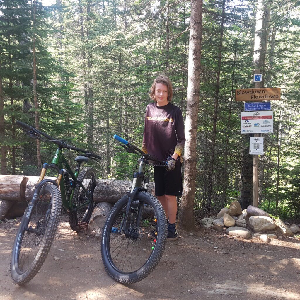 My son and our bikes at the top of Blowdown Flowdown trail in Hinton Alberta