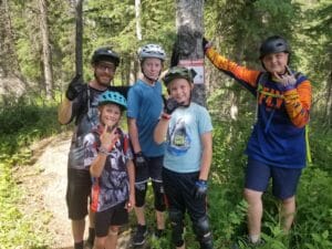 Coach matt with a group of riders during a sweet coaching session